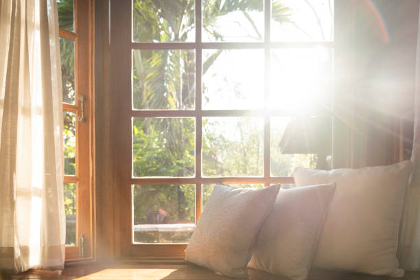 Livingroomwithpartofsofainsunnydayandwhitecurtain dream house energy Dream house energy